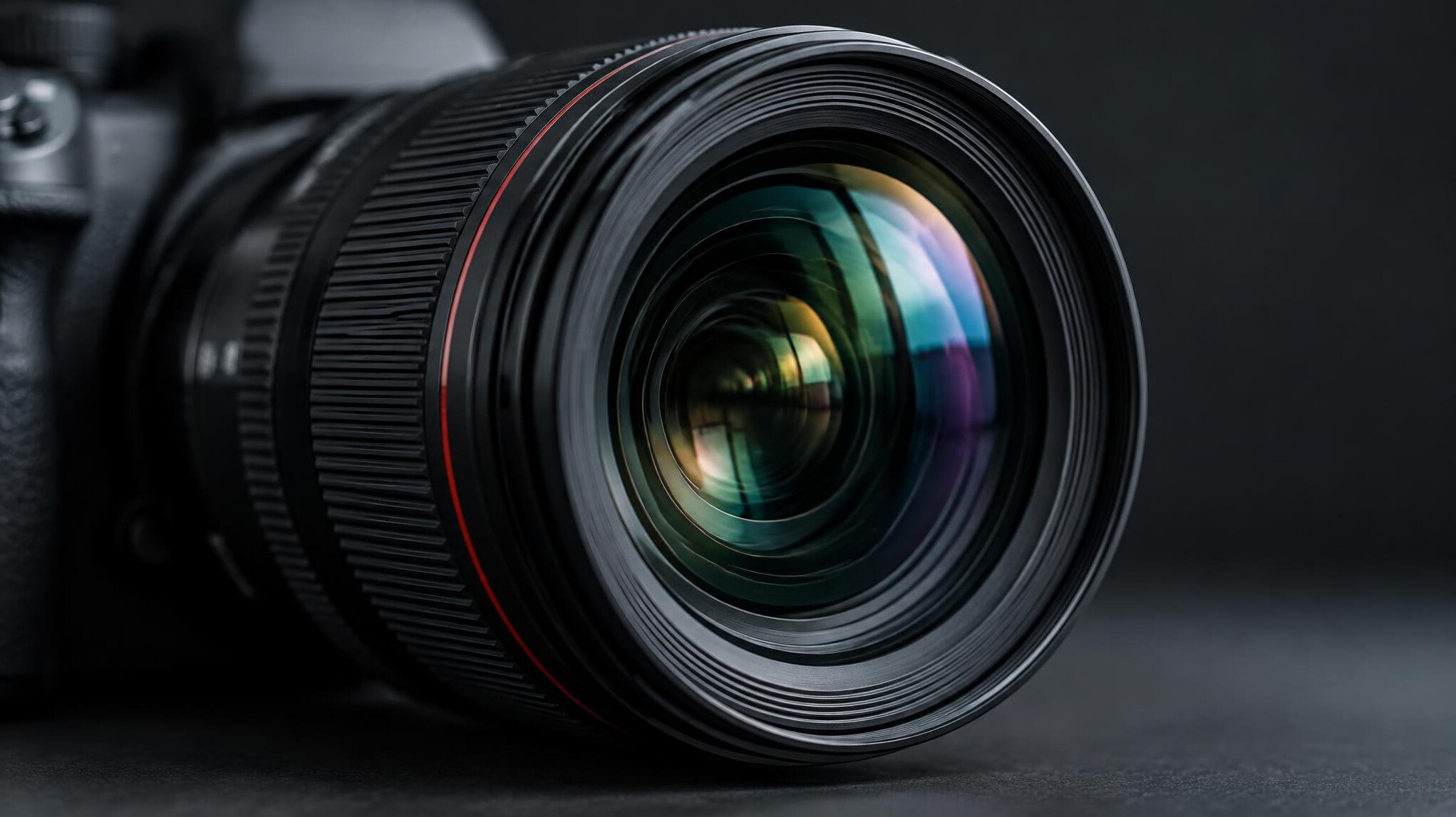 Close-up of a professional camera lens on a table